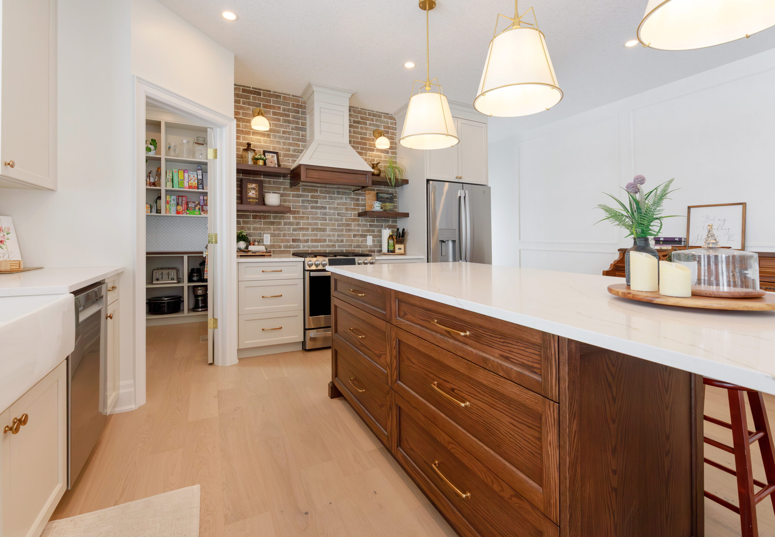 A FehrCo kitchen with warm white cabinetry, a wood island and generous preparation space