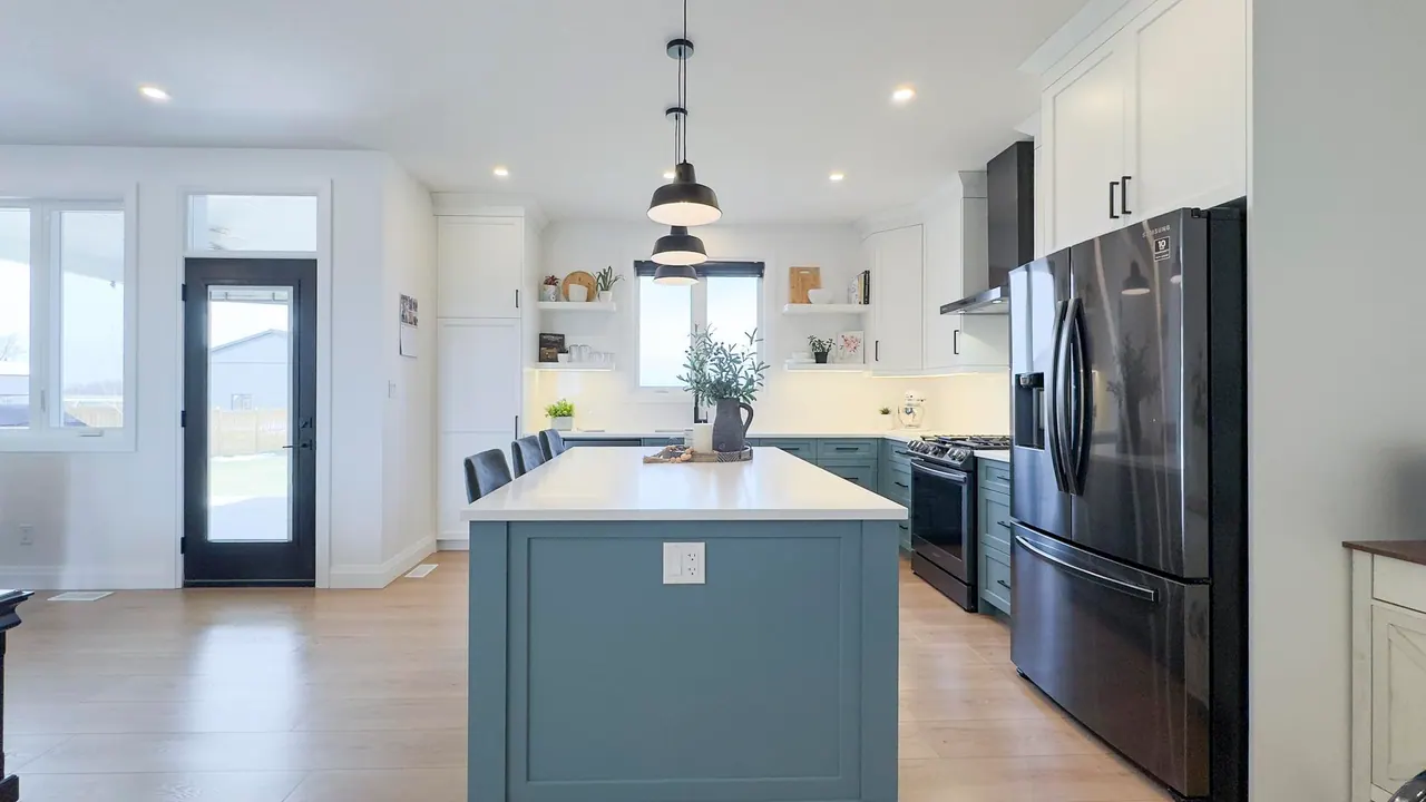 Kent Line kitchen with white cabinetry and a blue-green island