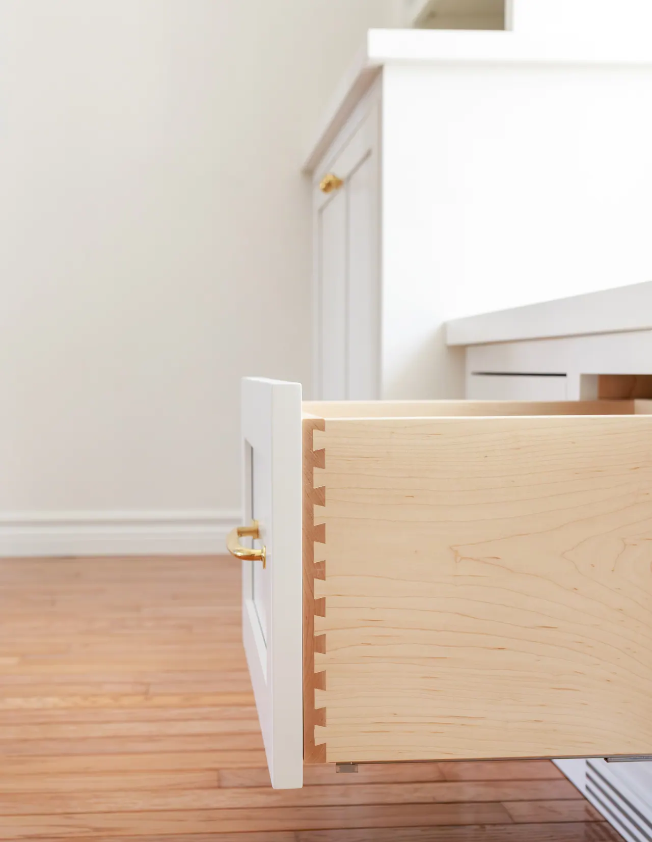 Close-up of a maple dovetail drawer in the Viscount built-in bench